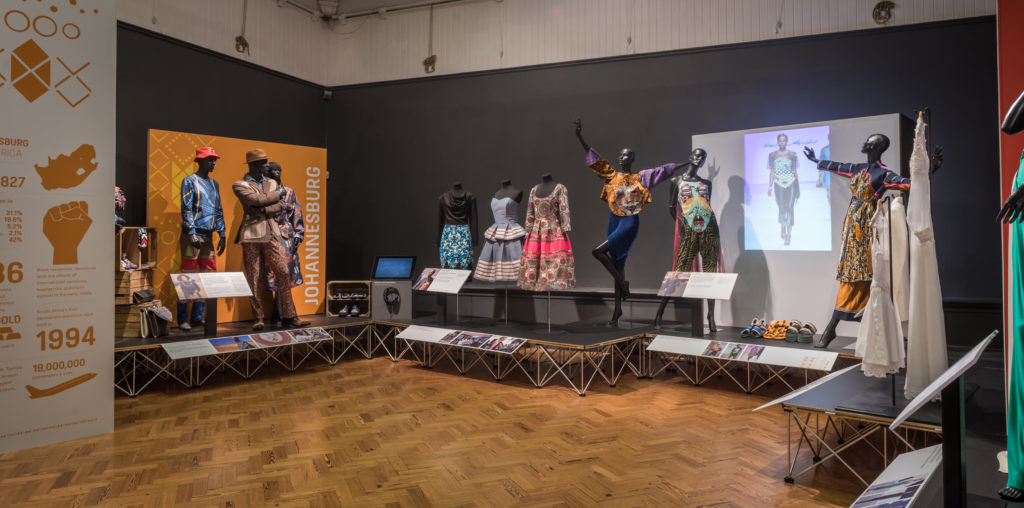 A museum display of outfits from South African designers