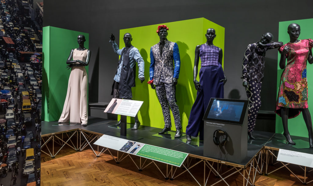 A museum display of six mannequins wearing outfits from Nigerian designers