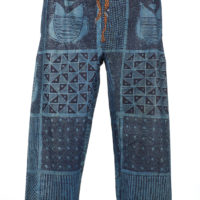 A pair of blue cotton trousers dyed with indigo in geometric patterns