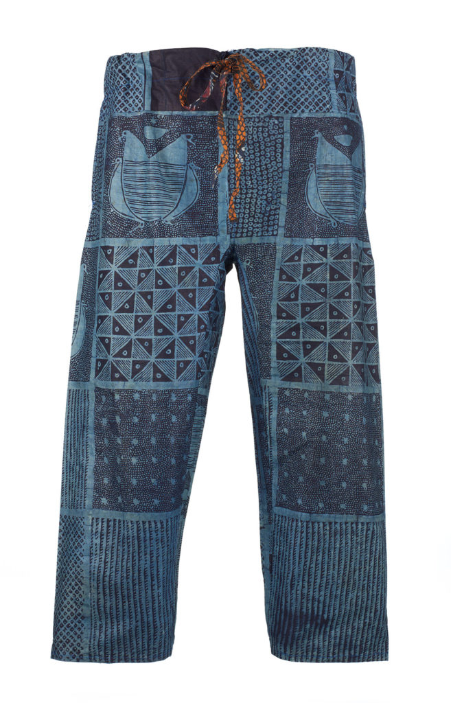 A pair of blue cotton trousers dyed with indigo in geometric patterns