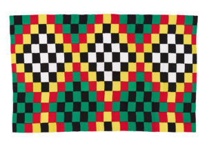 Woven textile featuring squares of black, white, yellow, red and green formed into a repeating diamond design.