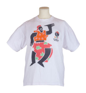 White T shirt with a stylised figure of a woman in a celebratory pose, and the logo of the political party UNIP