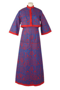Woman's maxi dress and matching jacket, made from blue and red adire stencilled fabric.