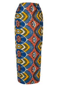 A woman's long pencil skirt made of blue, yellow, white and coral wax print fabric