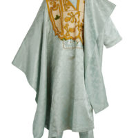 a mannequin wearing a long pale blue satin robe and matching trousers. The robe has islamic inspired golden embroidery at the chest and on the hem of the trousers.
