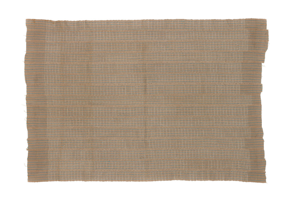 Narrow weave strip cotton cloth aso-oke fabric, with floating threads, beige with blue metallic stripes.