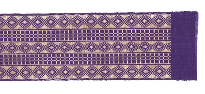 detail of purple aso-oke fabric with diamond and windowpane check designs