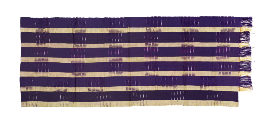 A strip of purple and gold aso-oke fabric