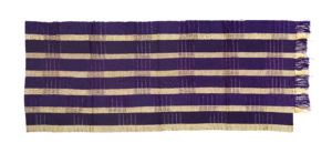 A strip of purple and gold aso-oke fabric