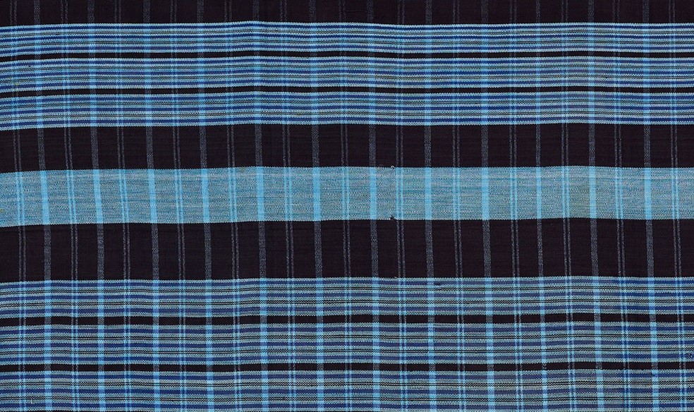strip woven cotton fabric in dark and pale blue stripes