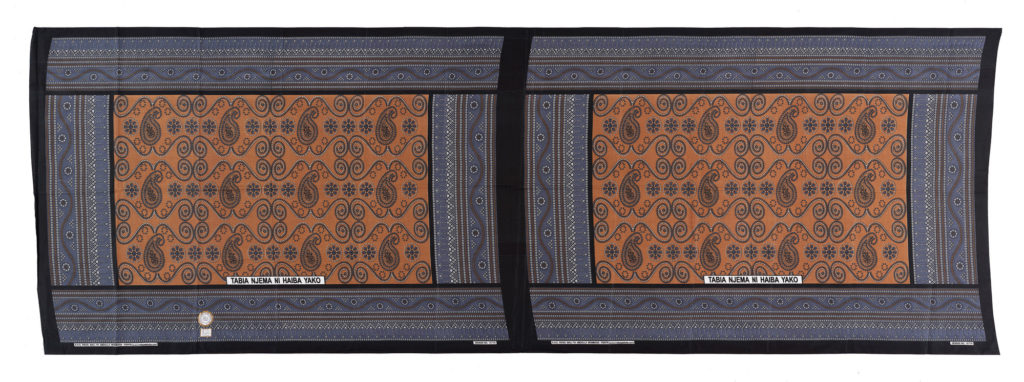 Unseparated pair of kanga cloths in a brown, grey, black and white design.