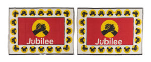 red, white, yellow and black cloth with two clasped hands and the word jubilee
