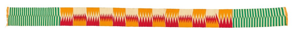 Kente strip woven with red, orange, white and green in a variety of zig zag patterns
