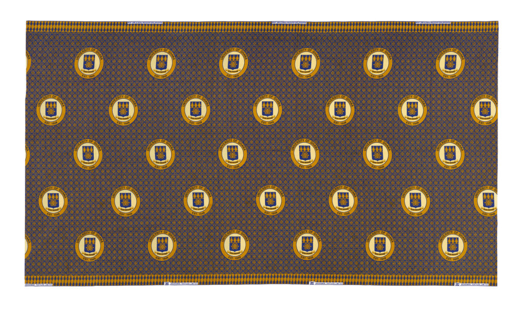 dark blue commemorative cloth featuring the repeat print of the university of Ghana crest