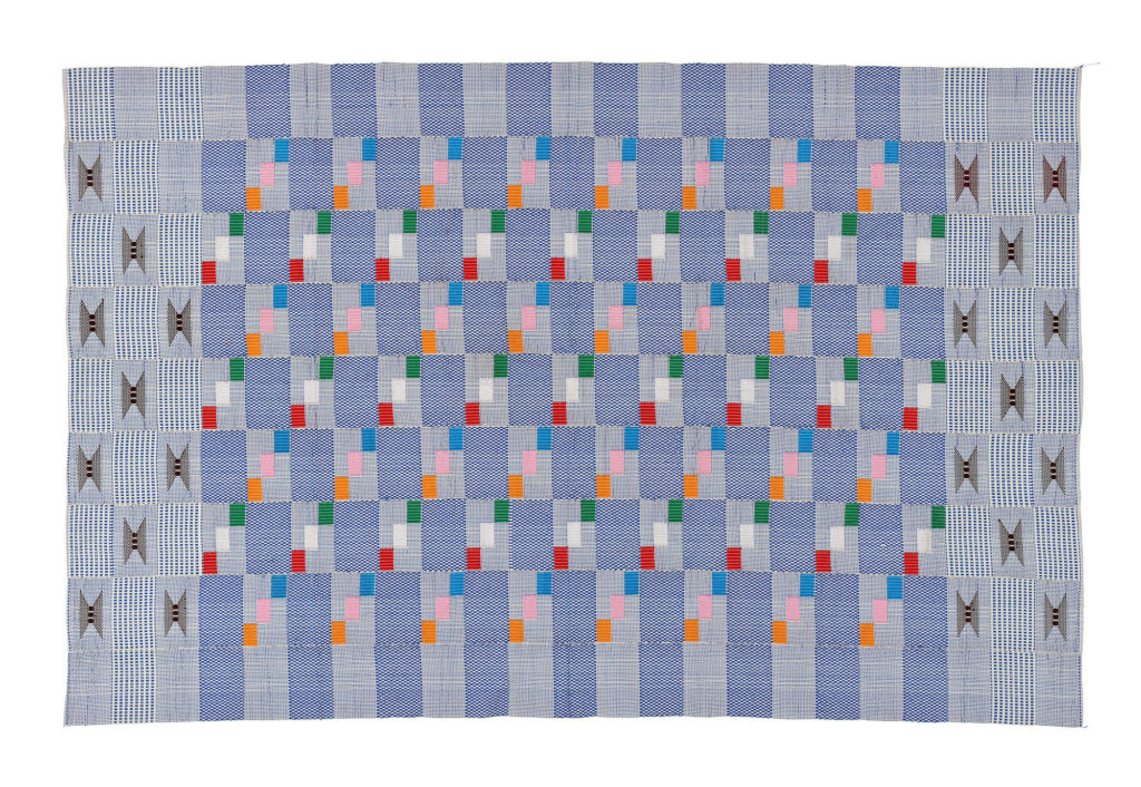 pale blue kente fabric with blocks of small pink, orange, green, white and red squares