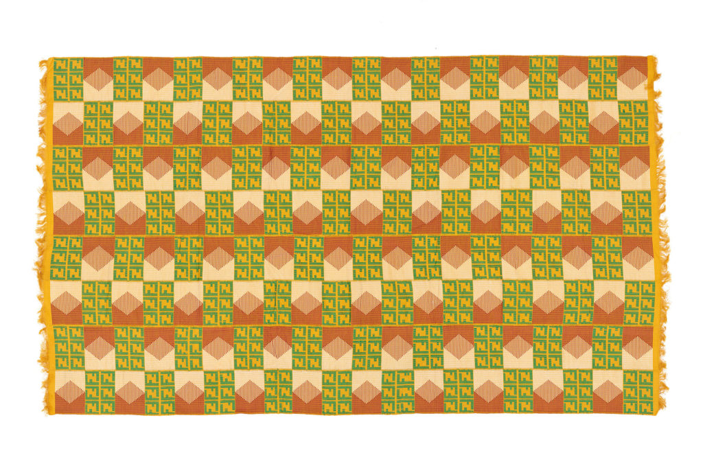 Kente cloth with alternating cream and maroon, and yellow and green shapes