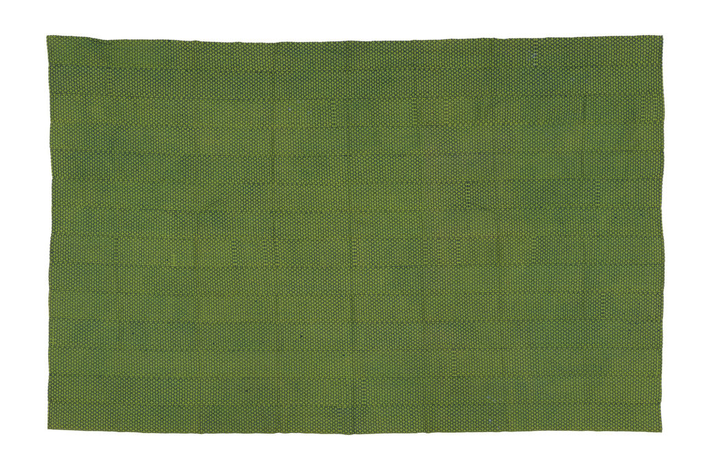 Intricately woven green kente cloth