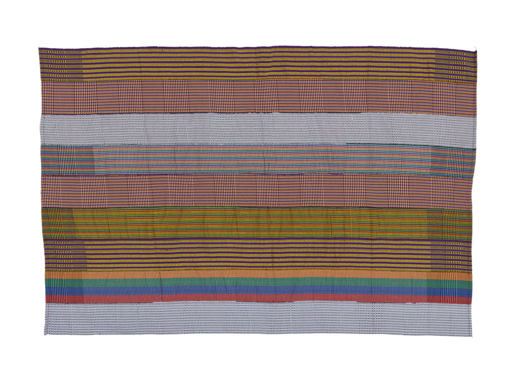 Kente made up of coloured strips representing different designs and techniques.