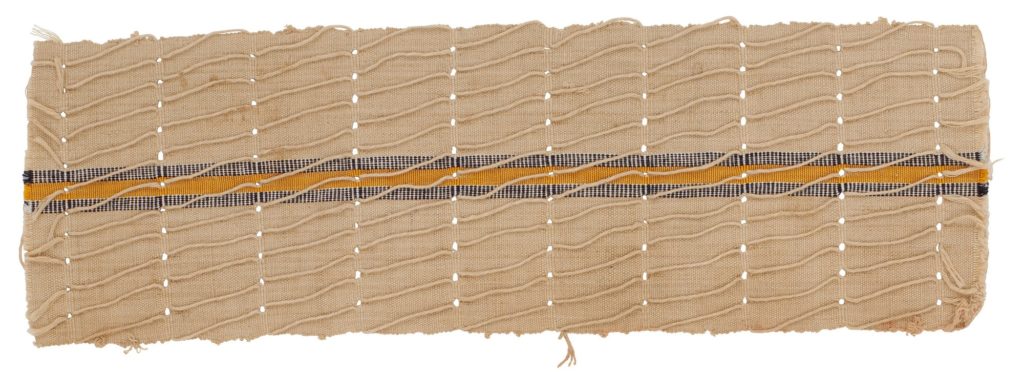 Aso-oke fabric strip. Beige with central vertical stripe of yellow with black and white on either side.
