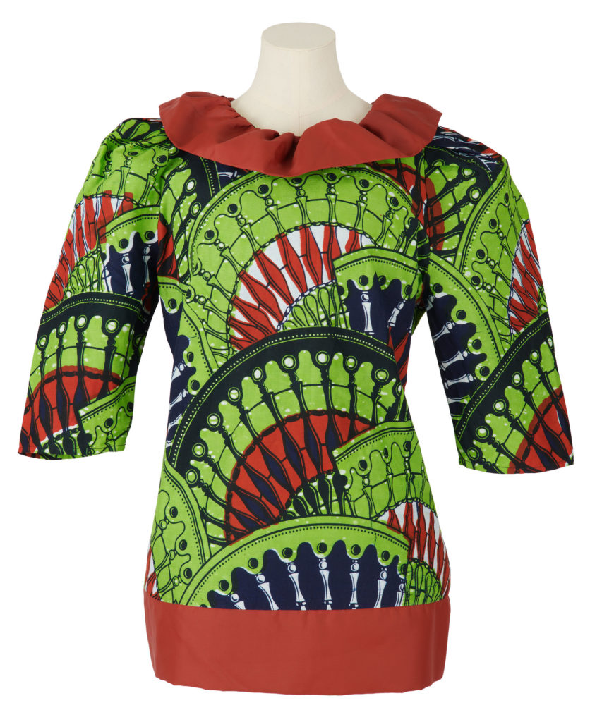 Woman's blouse in green, brown and black wax print with half length sleeves with brown collar and tie at the waist.