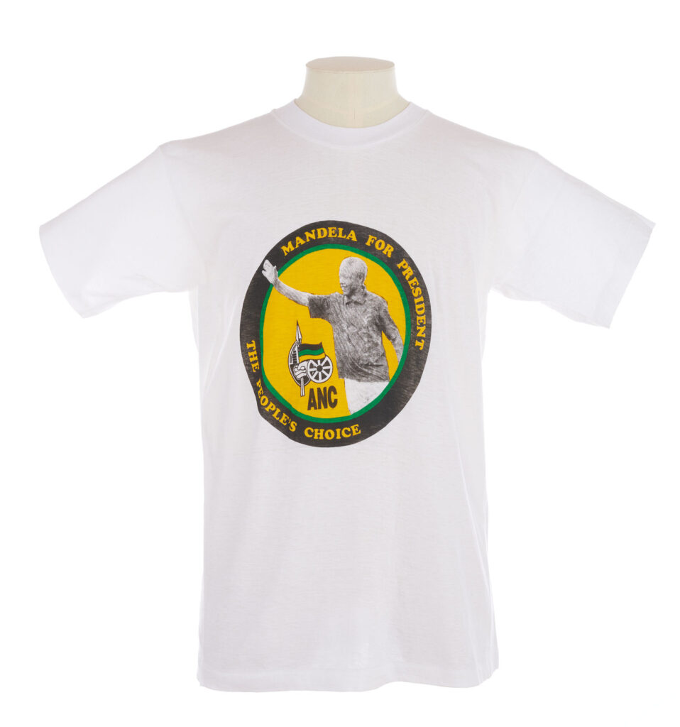 white T shirt with Mandela for President, the people's choice and image of Mandela in a yellow circle on the front