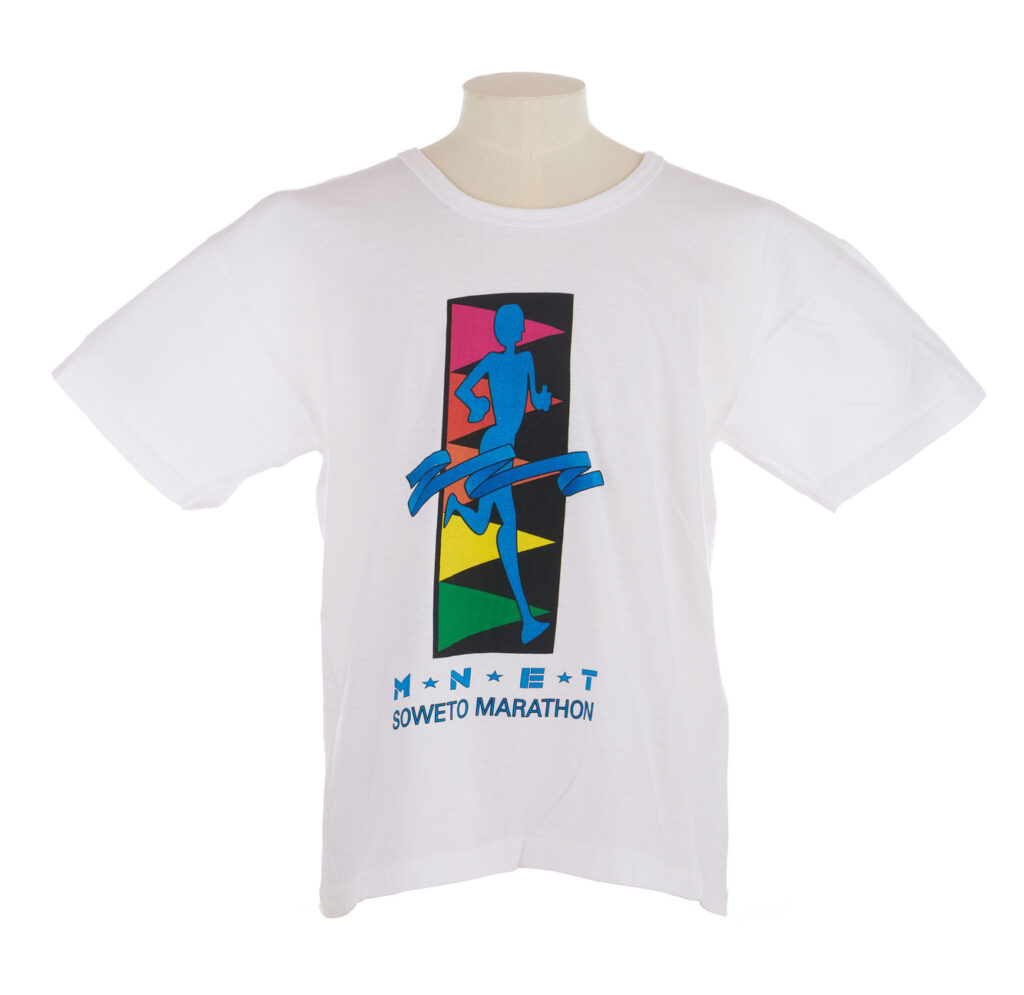 White T shirt with a cartoon of a runner and SOWETO MARATHON on the front