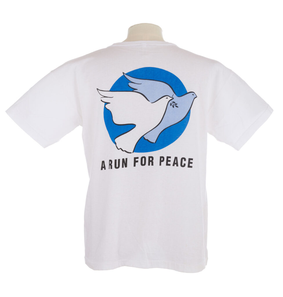White T shirt with blue doves logo on the back