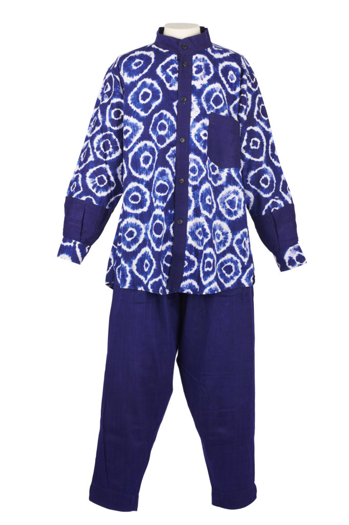 Dark indigo tie dyed with white circular designs with matching indigo trousers.