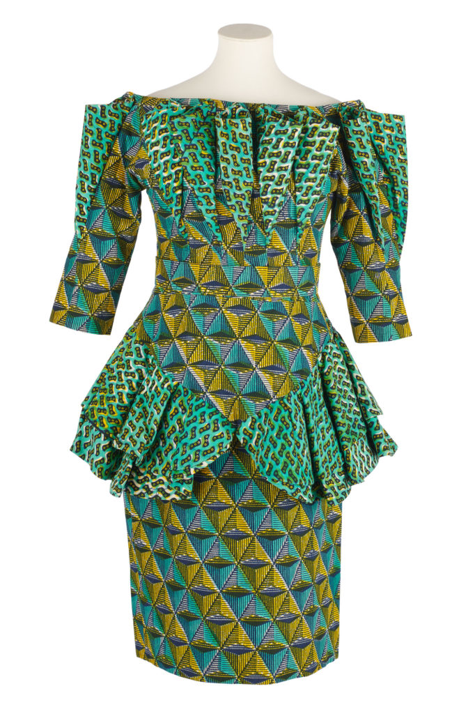 Woman's blouse and skirt outfit in two contrasting blue, yellow and green wax prints.