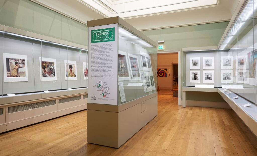 a museum gallery with photographs on display