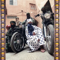 framed art photograph of five morroccan biker women wearing niqabs and kaftans in bold prints