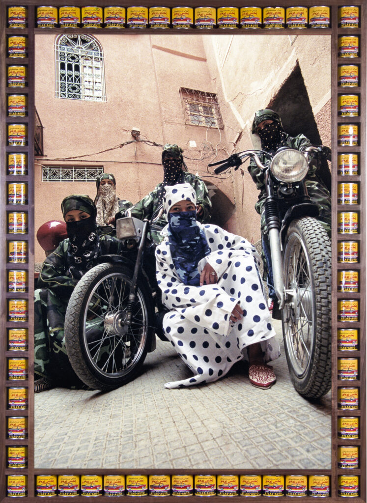 framed art photograph of five morroccan biker women wearing niqabs and kaftans in bold prints