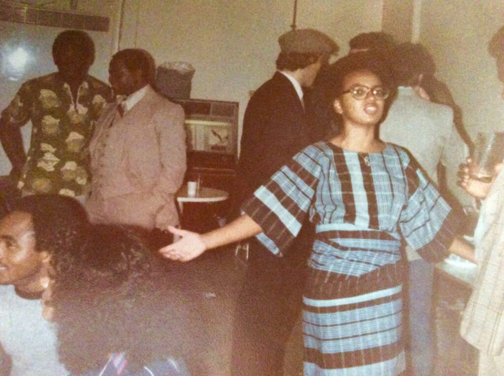 a woman wearing blue aso-oke student party in the 1980s