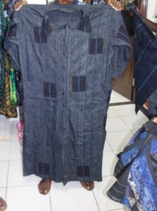 a long cotton shirt dress made of indigo adire and aso-oke fabric