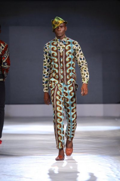 male catwalk model wearing a matching wax print suit and waistcoat