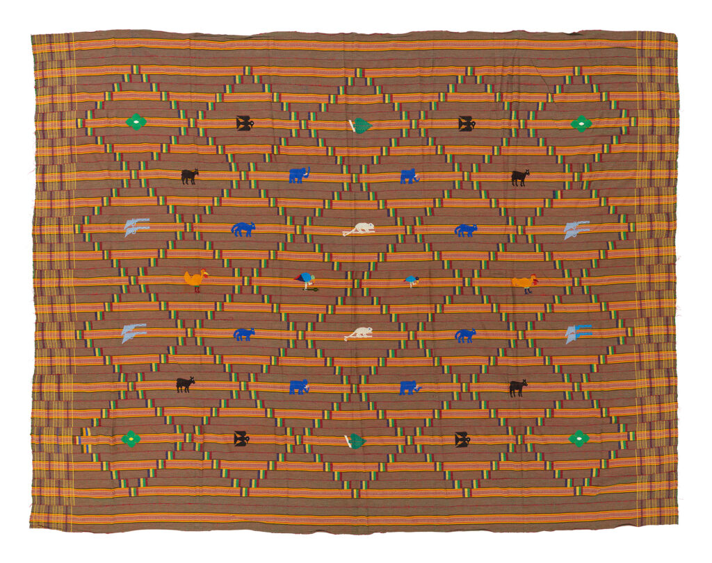 Brown and orange kente cloth with colourful animal motifs