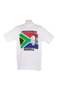 white T shirt with a portrait of Nelson Mandela and the South African flag