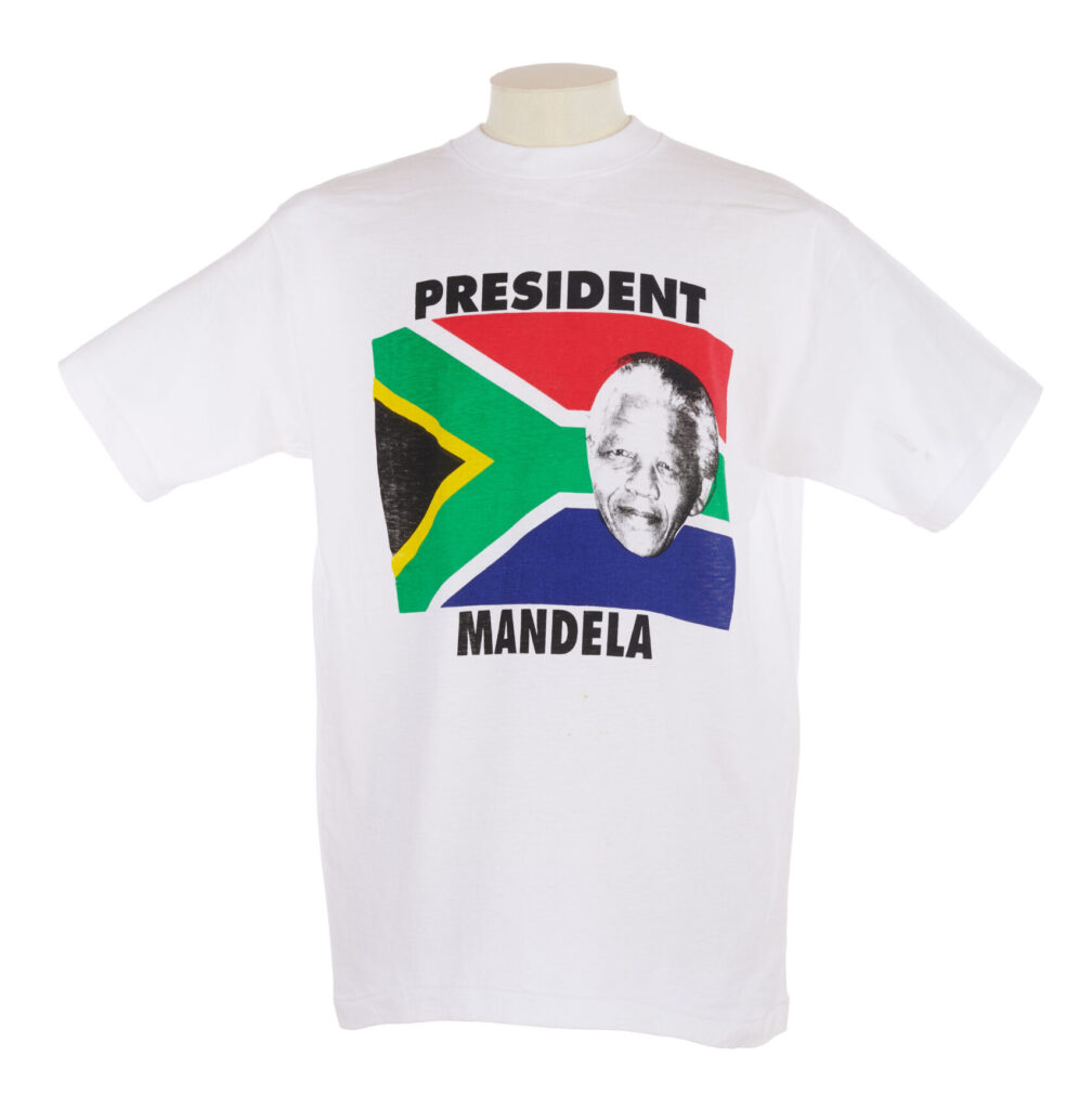 white T shirt with a portrait of Nelson Mandela and the South African flag