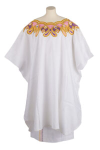 women's white boubou gown and skirt, with colourful embroidery at the collar